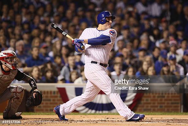 Anthony Rizzo of the Chicago Cubs hits a single in the first inning against the Cleveland Indians in Game Four of the 2016 World Series at Wrigley...