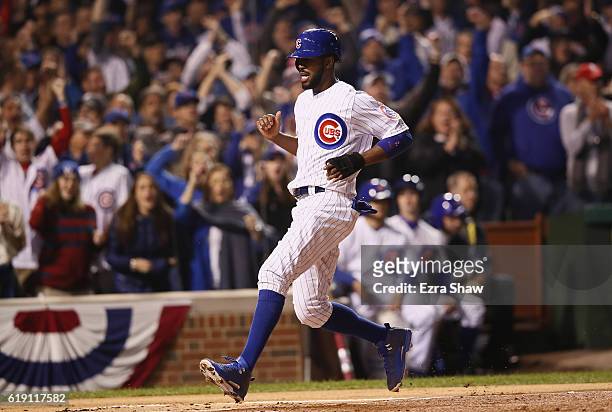 Dexter Fowler of the Chicago Cubs scores a run in the first inning against the Cleveland Indians in Game Four of the 2016 World Series at Wrigley...