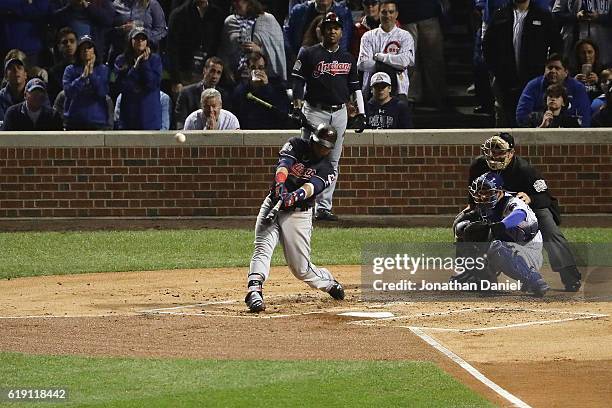 Carlos Santana of the Cleveland Indians hits a home run in the second inning against the Chicago Cubs in Game Four of the 2016 World Series at...