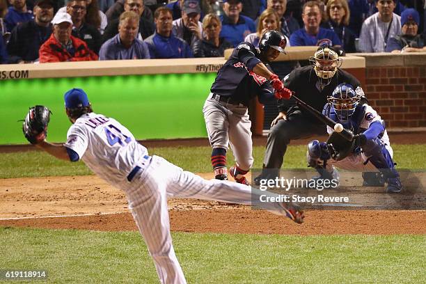 Francisco Lindor of the Cleveland Indians hits a single off of John Lackey of the Chicago Cubs in the third inning in Game Four of the 2016 World...
