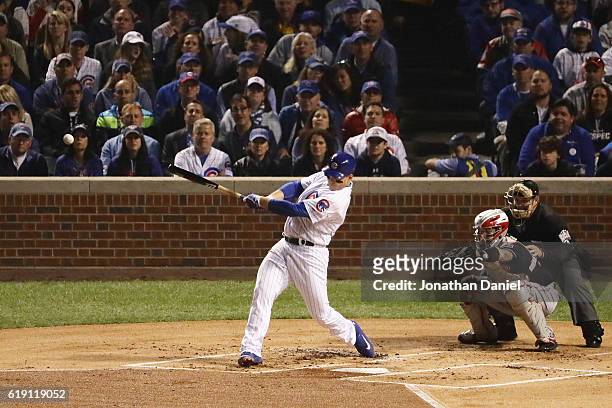 Anthony Rizzo of the Chicago Cubs hits a single in the first inning against the Cleveland Indians in Game Four of the 2016 World Series at Wrigley...