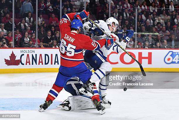 Andrew Shaw of the Montreal Canadiens checks Martin Marincin of the Toronto Maple Leafs in the NHL game at the Bell Centre on October 29, 2016 in...
