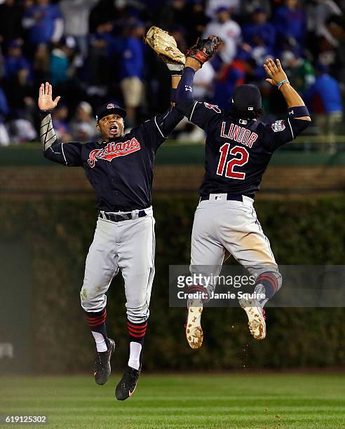 Rajai Davis and Francisco Lindor of the Cleveland Indians celebrate after beating the Chicago Cubs 7-2 in Game Four of the 2016 World Series at...