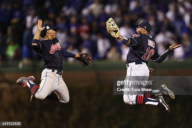 Francisco Lindor and Rajai Davis of the Cleveland Indians celebrate after beating the Chicago Cubs 7-2 in Game Four of the 2016 World Series at...