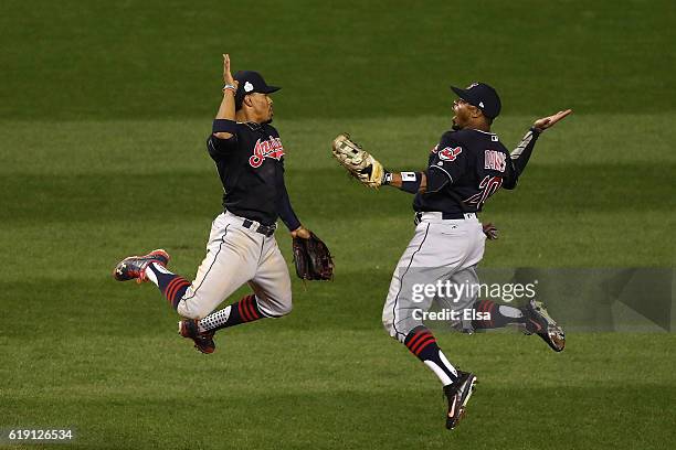 Francisco Lindor and Rajai Davis of the Cleveland Indians celebrate after beating the Chicago Cubs 7-2 in Game Four of the 2016 World Series at...