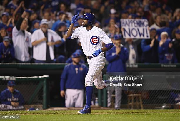 Dexter Fowler of the Chicago Cubs rounds the bases after hitting a home run in the eighth inning against the Cleveland Indians in Game Four of the...