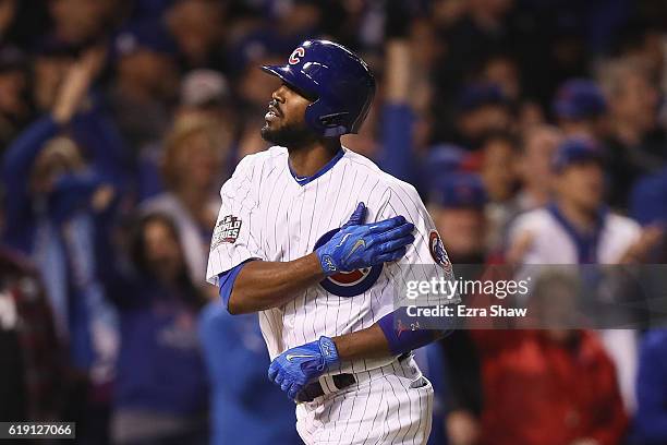 Dexter Fowler of the Chicago Cubs celebrates after hitting a home run in the eighth inning against the Cleveland Indians in Game Four of the 2016...
