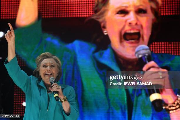 Democratic presidential nominee Hillary Clinton speaks during "Go Out to Vote" concert at the Bayfront Park Amphitheater in Miami, Florida, on...