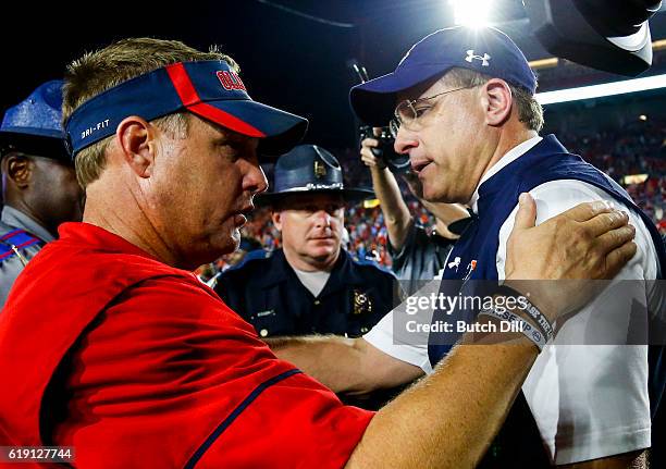 Mississippi Rebels head coach Hugh Freeze talks with Auburn Tigers head coach after the Auburn Tigers defeated the Mississippi Rebels 40-29 of an...