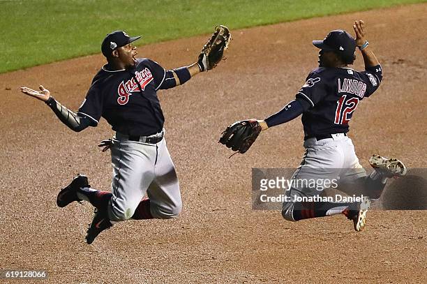 Francisco Lindor and Rajai Davis of the Cleveland Indians celebrate after beating the Chicago Cubs 7-2 in Game Four of the 2016 World Series at...