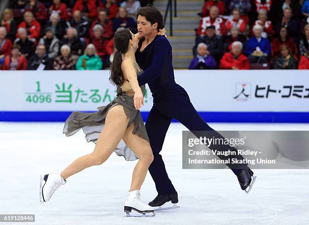 Tessa Virtue and Scott Moir of Canada compete in the Ice Dance Free Program during the ISU Grand Prix of Figure Skating Skate Canada International at...