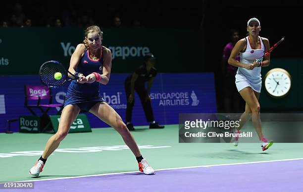 Ekaterina Makarova and Elena Vesnina of Russia in action in their doubles semi-final against Martina Hingis of Switzerland and Sania Mirza of India...