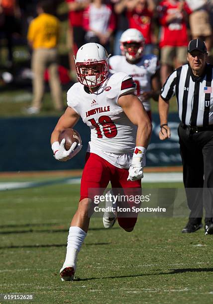 Louisville Cole Hikutini rushes upfield during an NCAA football game between the Louisville Cardinals and the Virginia Cavaliers on October 29 at...