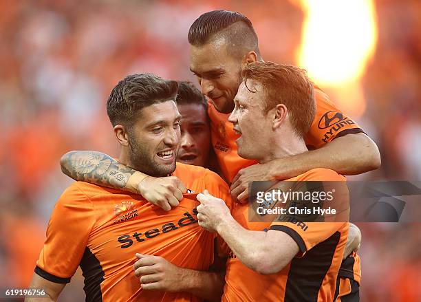 Brandon Borello of the Roar celebrates with team mates after scoring a goal during the round four A-League match between the Brisbane Roar and Perth...