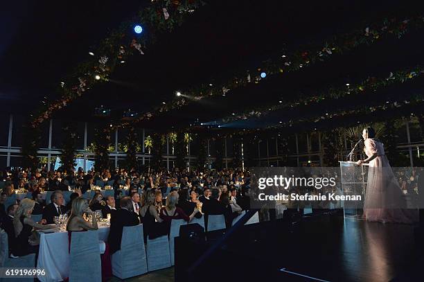 Host Eva Chow, wearing Gucci, speaks onstage during the 2016 LACMA Art + Film Gala Honoring Robert Irwin and Kathryn Bigelow Presented By Gucci at...