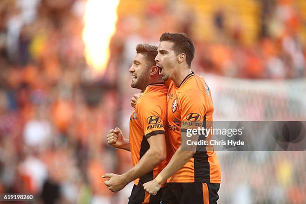 Brandon Borello of the Roar celebrates with team mate Jamie Maclaren after scoring a goal during the round four A-League match between the Brisbane...