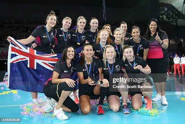 Maria Tutaia, captain of New Zealand and her teammates celebrate with the trophy after winning the Grand Final of the Fast5 Netball Series between...