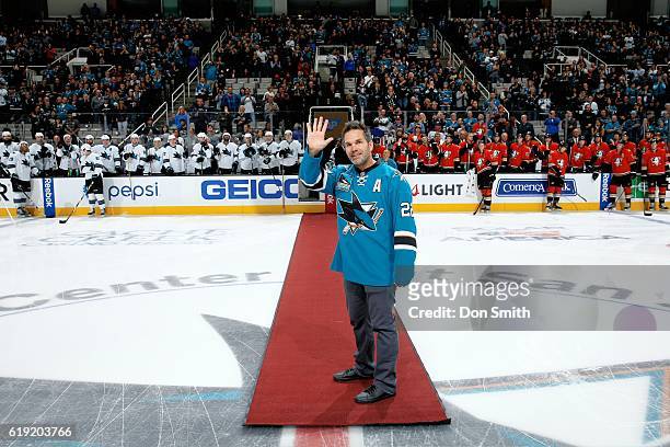 Retired Sharks defenseman Dan Boyle waves to fans during the opening ceremonies of the San Jose Sharks versus the Anaheim Ducks NHL game at SAP...