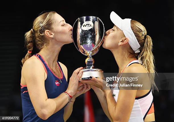 Ekaterina Makarova and Elena Vesnina of Russia kiss the trophy after victory in the doubles final match against Bethanie Mattek-Sands of the United...