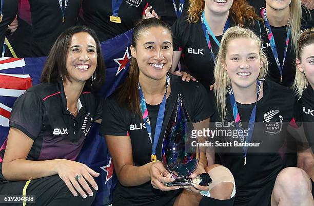 Maria Tutaia, captain of New Zealand and her teammates celebrate with the trophy after winning the Grand Final of the Fast5 Netball Series between...