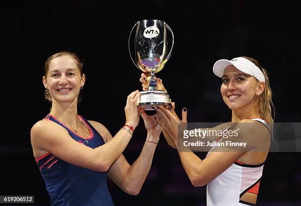 Ekaterina Makarova and Elena Vesnina of Russia pose with the trophy after victory in the doubles final match against Bethanie Mattek-Sands of the...