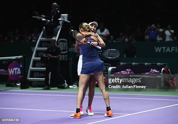Elena Vesnina and Ekaterina Makarova of Russia celebrate victory in the doubles final match against Bethanie Mattek-Sands of the United States and...