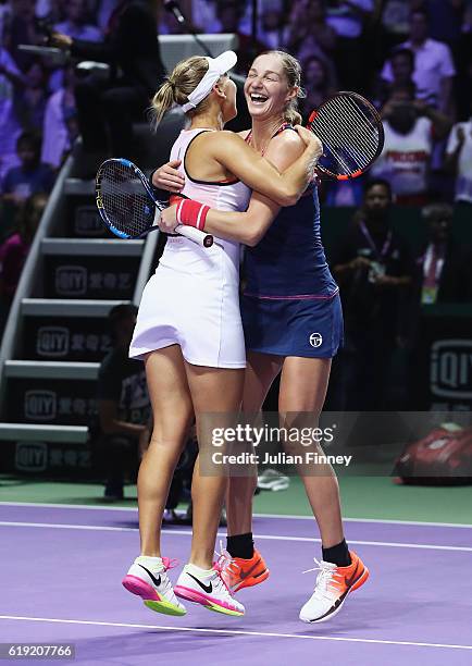 Ekaterina Makarova and Elena Vesnina of Russia celebrate victory in the doubles final match against Bethanie Mattek-Sands of the United States and...