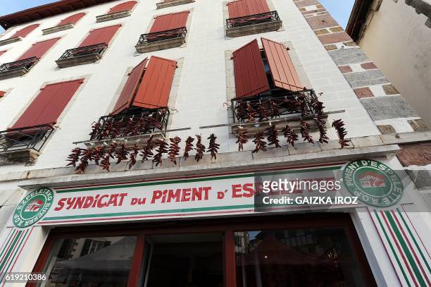 Photo shows Espelette peppers on display on the wall of the house of the Syndicat du Piment d'Espelette on October 30, 2016 in Espelette, southern...