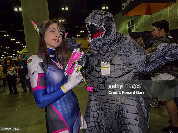 Cosplayer Angela Domarico and Gamera Cosplayer at Los Angeles Convention Center on October 29, 2016 in Los Angeles, California.