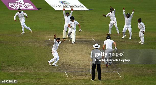 Mehedi Hasan of Bangladesh successfully appeals for the final wicket of Steven Finn to win the second Test match between Bangladesh and England at...