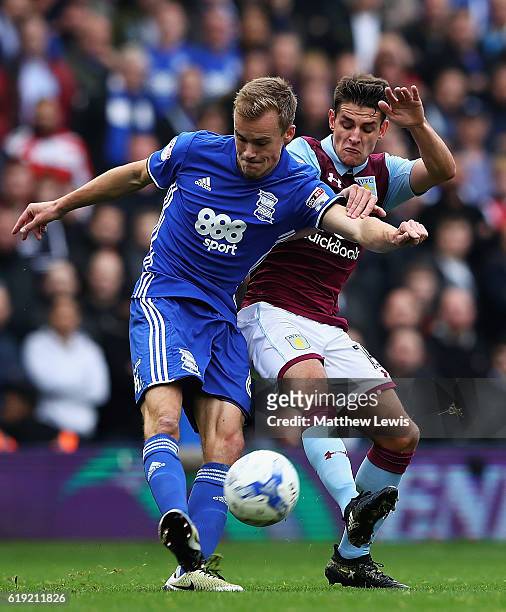 Maikel Kieftenbeld of Birmingham City and Ashley Westwood of Aston Villa challenge for the ball during the Sky Bet Championship match between...