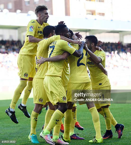 Villarreal's players celebrate their first goal during the Spanish league football match between SD Eibar and Villarreal CF at the Ipurua stadium in...