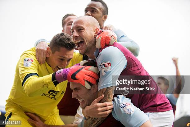 Pierluigi Gollini and Alan Hutton of Aston Villa celebrates with Gary Gardner after he scores during the Sky Bet Championship match between...