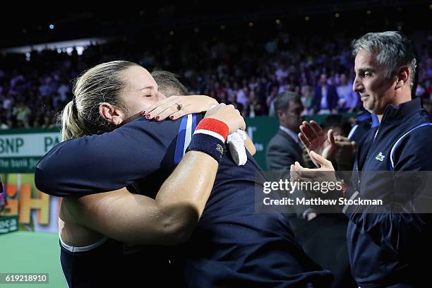 Dominika Cibulkova of Slovakia celebrates victory with Miso Navara after her singles final against Angelique Kerber of Germany during day 8 of the...