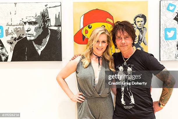 Actress Abi Titmuss and Artist Billy Morrison pose for a picture at the Gallery Opening Of "Social Distortion: A Capsule Collection Of Fine Art By...