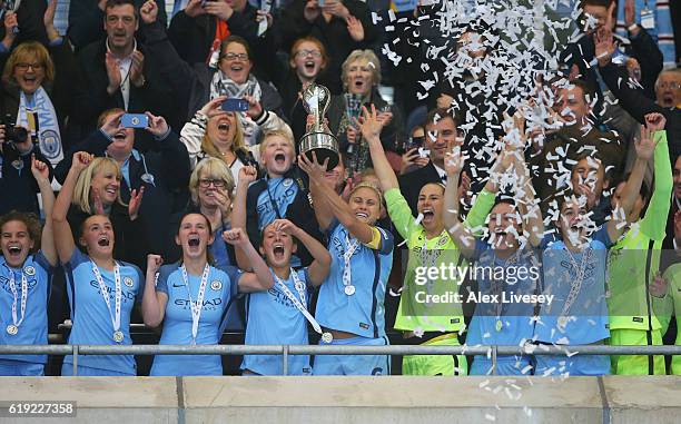 Captain Steph Houghton lifts the trophy after her side won the Women's Super Leauge1 during Women's Super League1 match between Manchester City and...