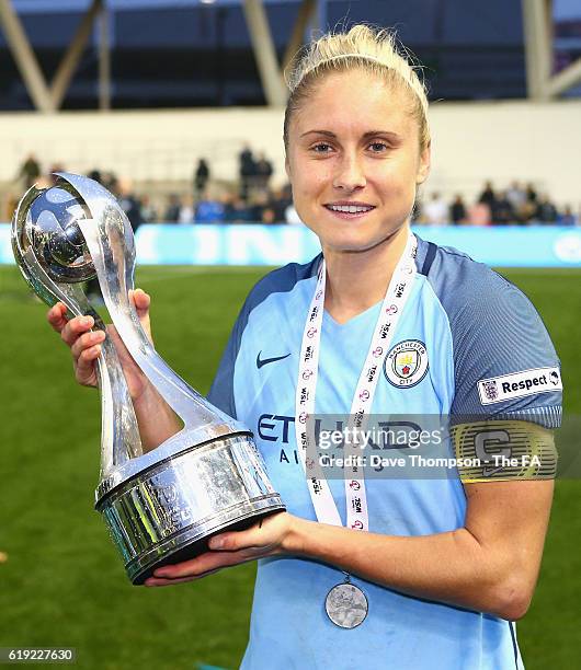 Captain Steph Houghton of Manchester City poses with the Women's Super Leauge1 trophy during Women's Super League1 match between Manchester City and...