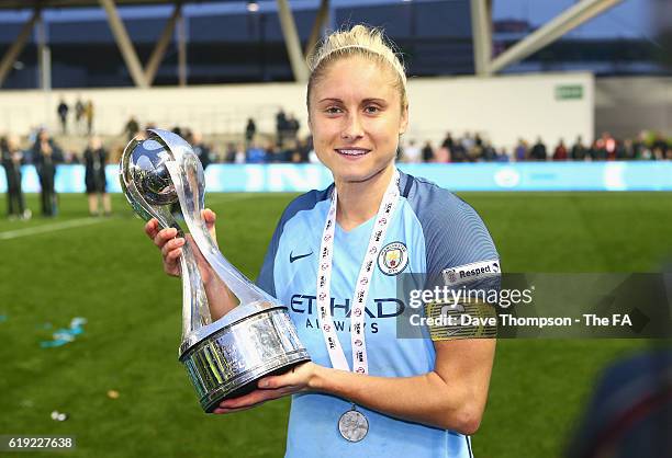 Captain Steph Houghton of Manchester City poses with the Women's Super Leauge1 trophy during Women's Super League1 match between Manchester City and...