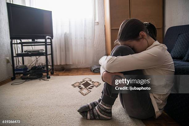teen woman with headache holding her head - left out stock pictures, royalty-free photos & images