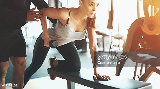 gym workout. - rowing stock pictures, royalty-free photos & images