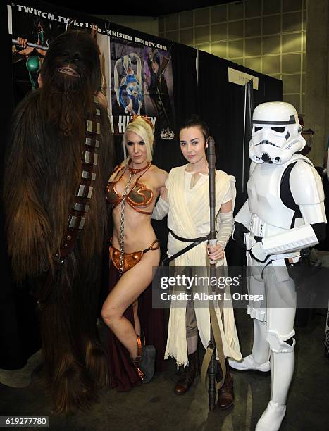 Cosplayers Kristen Hughey and Megan Golden with a Storm Trooper and Chewbacca on day 2 of Stan Lee's Los Angeles Comic Con 2016 held at Los Angeles...
