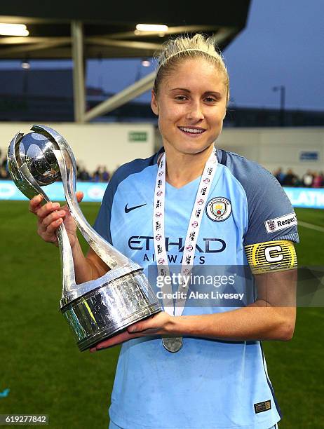 Captain Steph Houghton of Manchester City poses with the Women's Super Leauge1 trophy during Women's Super League1 match between Manchester City and...