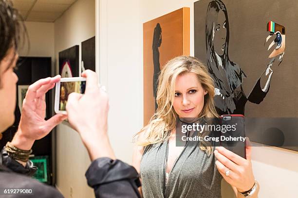 Actress Abi Titmuss takes a selfie at the Gallery Opening Of "Social Distortion: A Capsule Collection Of Fine Art By Billy Morrison" at Art On Scene...
