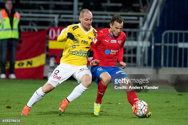 Christoffer Carlsson of Falkenbergs FF and Anton Wede of Helsingborgs IF fight for the ball during the Allsvenskan match between Falkenbergs FF and...