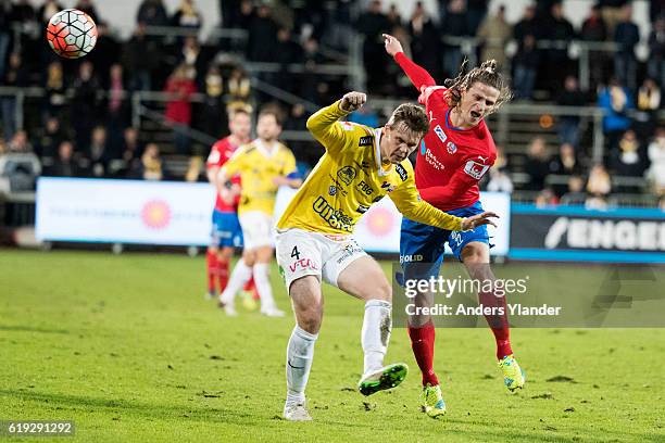 Jesper Lange of Helsingborgs IF tackles Daniel Johansson of Falkenbergs FF during the Allsvenskan match between Falkenbergs FF and Helsingborgs IF at...