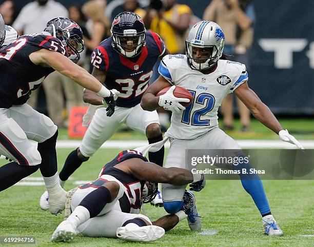 Andre Roberts of the Detroit Lions is wrapped up by Akeem Dent of the Houston Texans on a kickoff return in the third quarter at NRG Stadium on...