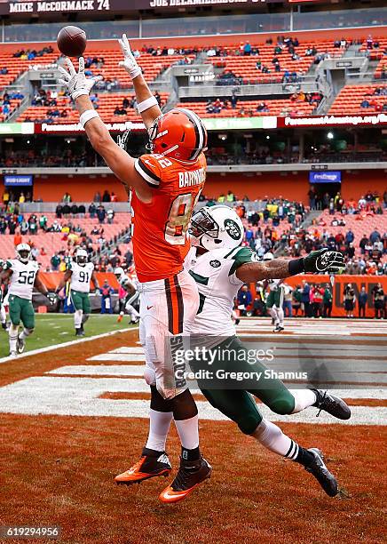 Gary Barnidge of the Cleveland Browns is pushed out of bounds by Rontez Miles of the New York Jets during the fourth quarter at FirstEnergy Stadium...