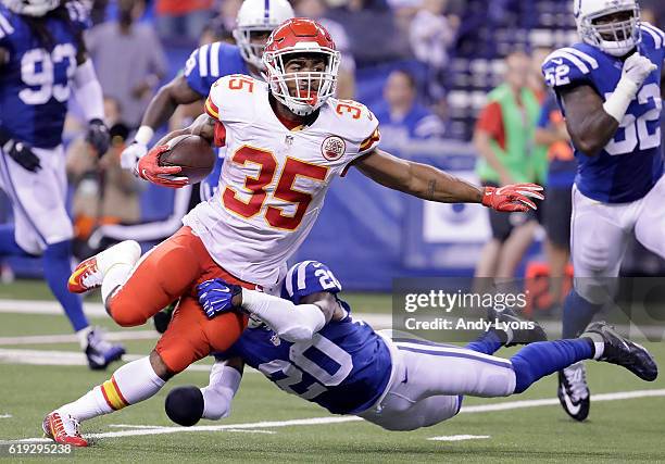 Charcandrick West of the Kansas City Chiefs runs with the ball during the third quarter of the game against the Indianapolis Colts at Lucas Oil...