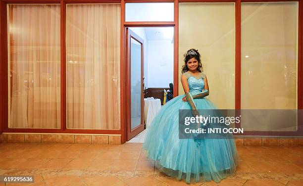 Year-old cancer patient poses for a picture during a 15th birthday party organized for her and 50 other cancer patient girls in Managua on October...