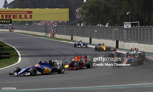 Daniel Ricciardo of Australia driving the Red Bull Racing Red Bull-TAG Heuer RB12 TAG Heuer hunts down Felipe Nasr of Brazil driving the Sauber F1...